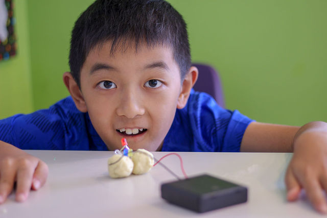 Children building in the makerspace at Pear Tree camp